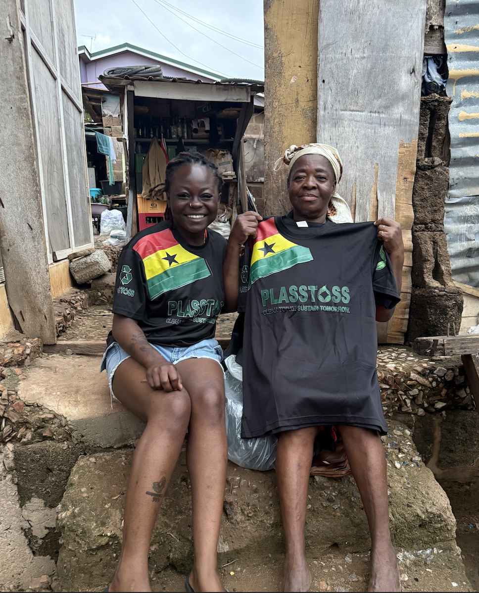 Two collectors holding up Plastoss jerseys outside a shop
