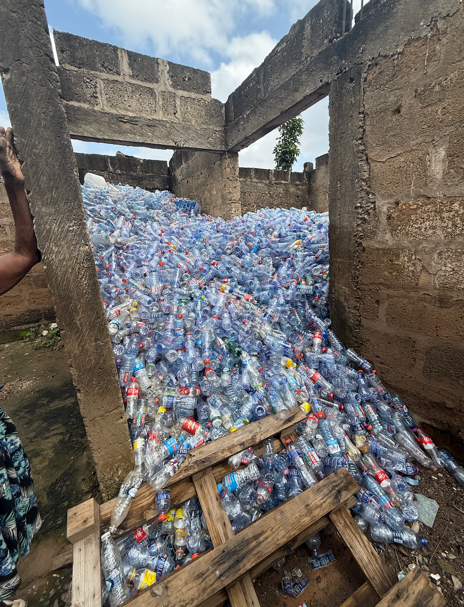 A room overflowing with recovered plastic bottles